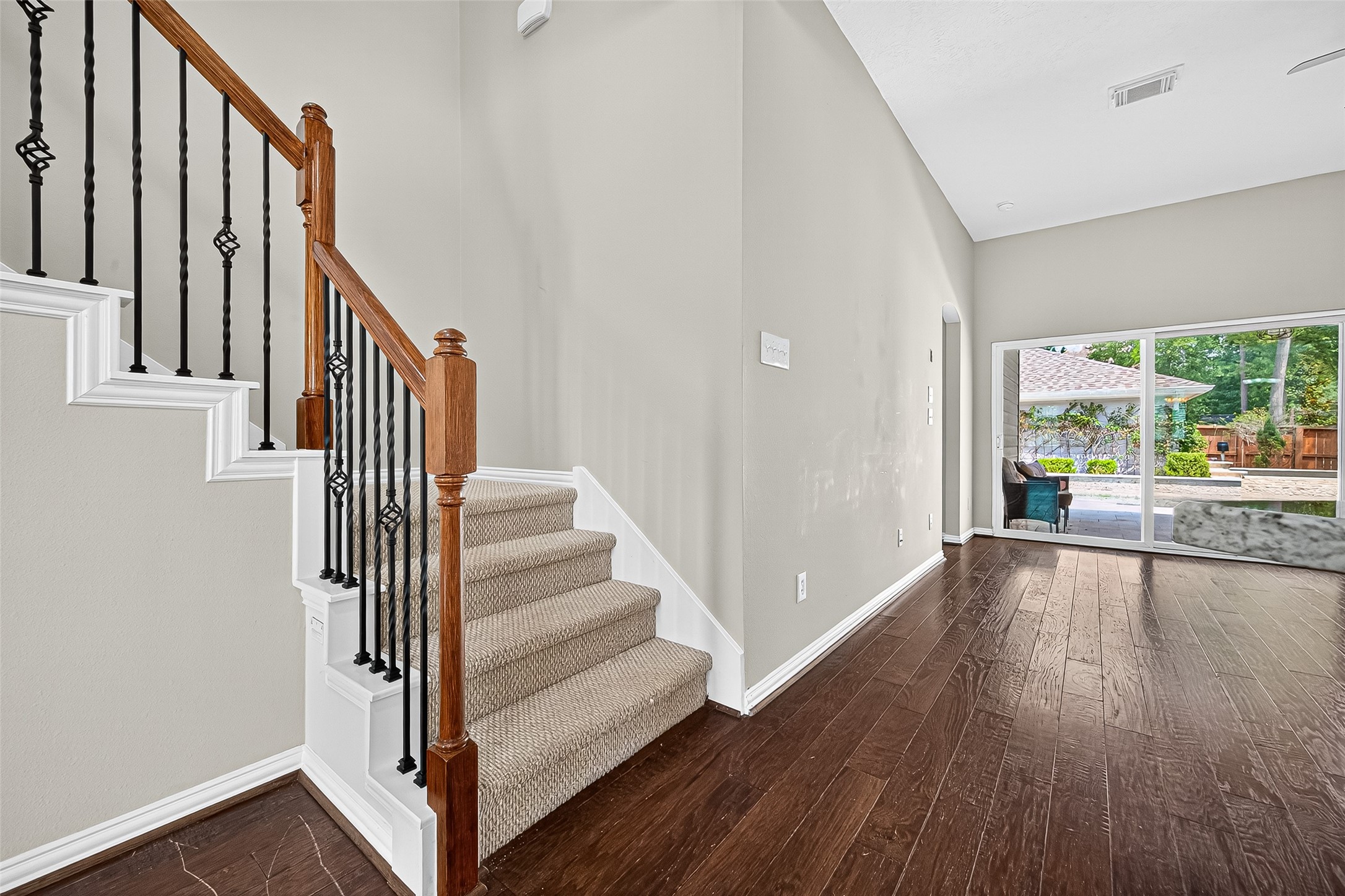 30 Whetstone Ridge Way The Woodlands, TX 77382 - Photo 5 of 39 a view of a hallway with wooden floor and entryway