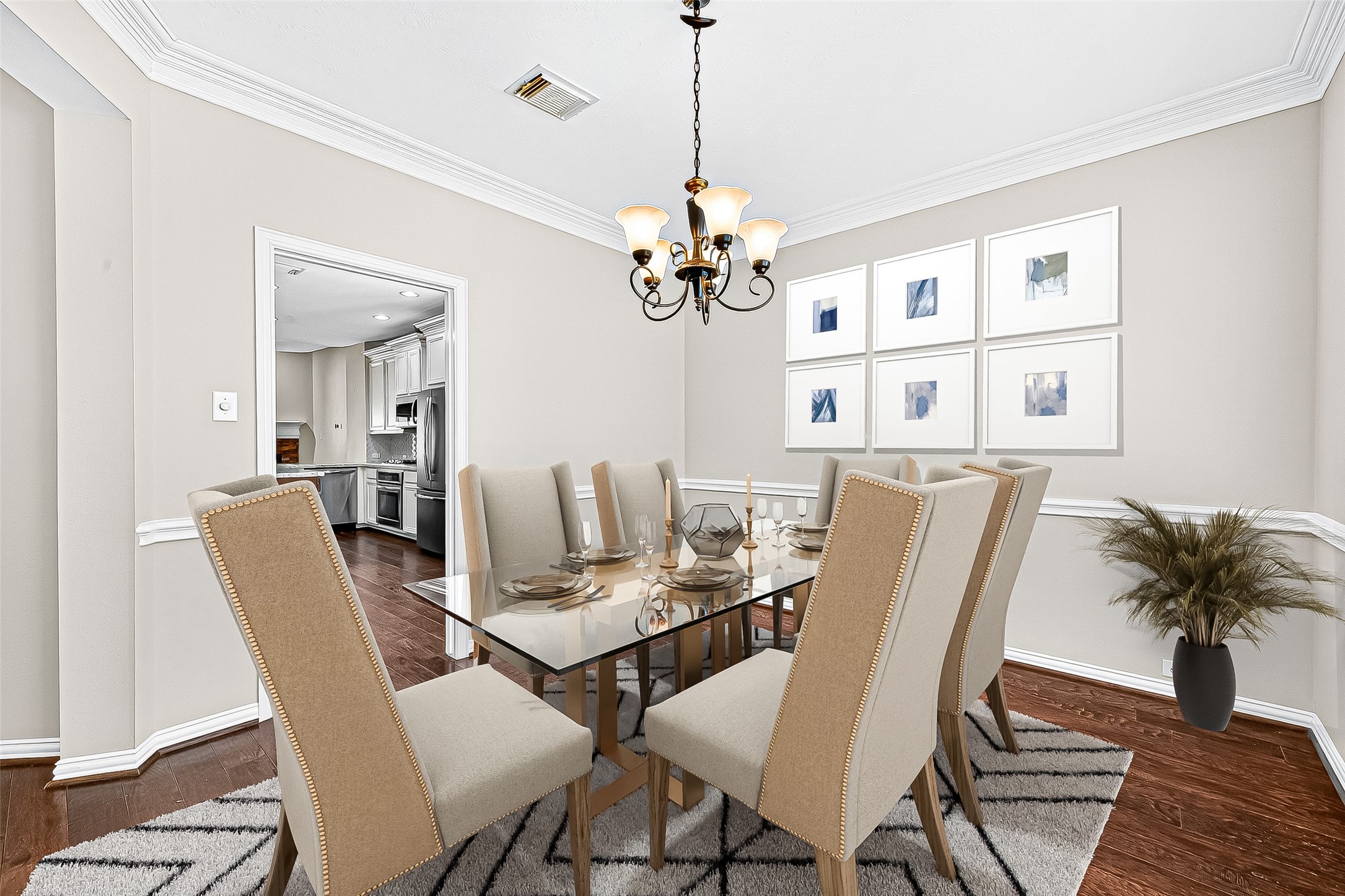 30 Whetstone Ridge Way The Woodlands, TX 77382 - Photo 8 of 39 a view of a dining room with furniture and a chandelier