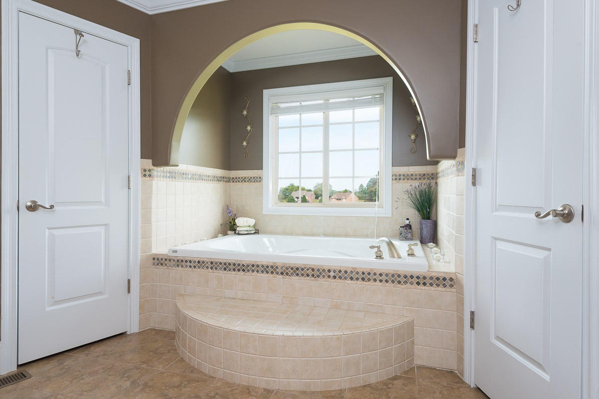 3929 Old Niles Ferry Road Maryville, TN 37801 - Photo 11 of 26 a bathroom with a tub sink and mirror