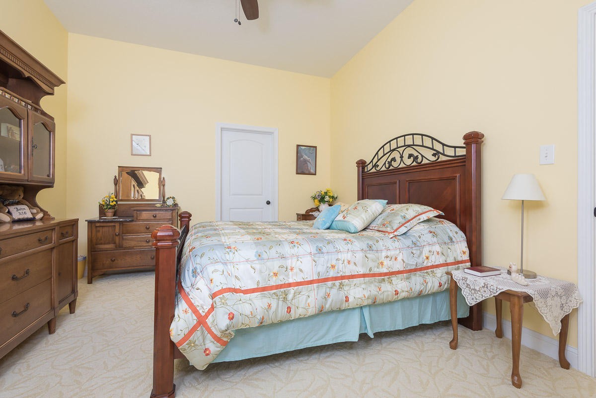 3929 Old Niles Ferry Road Maryville, TN 37801 - Photo 19 of 26 a bedroom with a bed and a lamp on the dresser