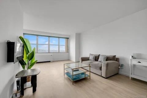 a living room with furniture and a pool table