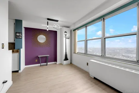a view of a livingroom with furniture and windows