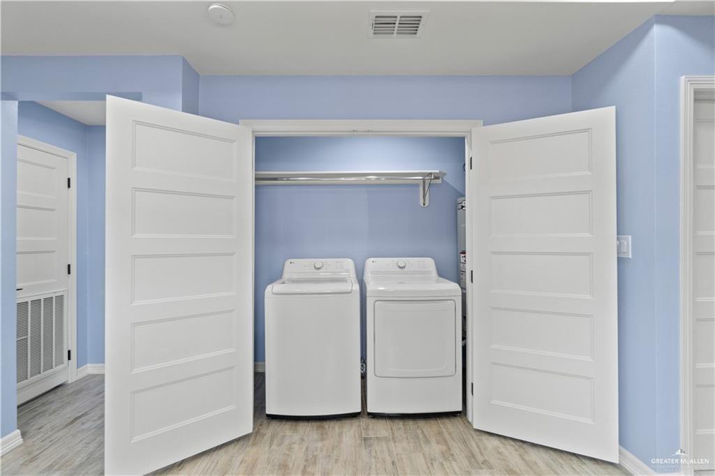 2118 Earth Lane Mission, TX 78573 - Photo 16 of 26 a utility room with dryer and washer