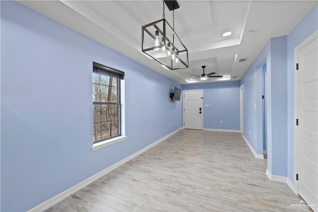 2118 Earth Lane Mission, TX 78573 - Photo 17 of 26 wooden floor in an empty room with a window