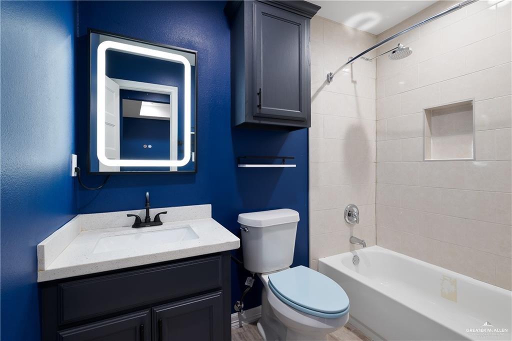 2118 Earth Lane Mission, TX 78573 - Photo 2 of 26 a bathroom with a sink toilet and shower