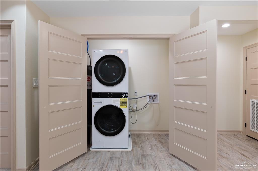 2118 Earth Lane Mission, TX 78573 - Photo 10 of 26 a view of a hallway with washer and dryer