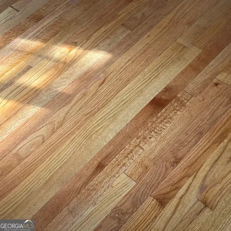 a kitchen with a stove a refrigerator and a sink
