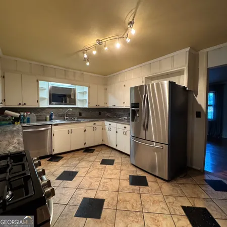 a bathroom with a bathtub and a window