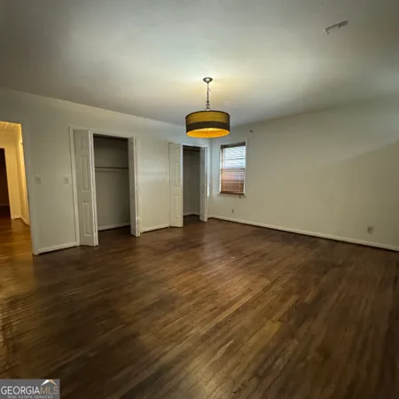 a view of empty room with a fireplace