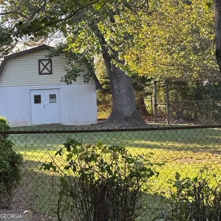 a backyard of a house with lots of green space