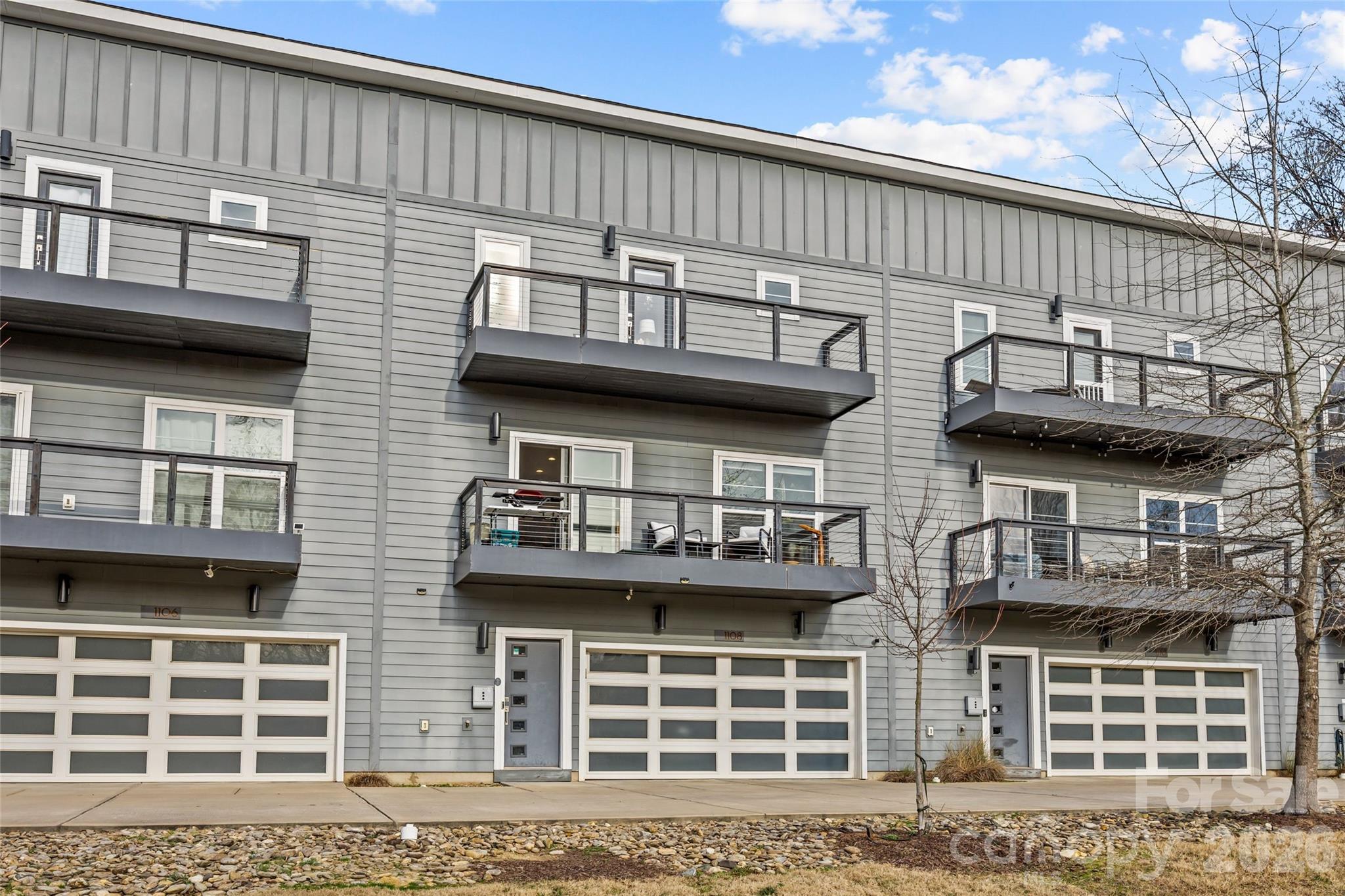 1108 North Alexander Street Charlotte, NC 28206 - Photo 2 of 37 a view of a house with large windows