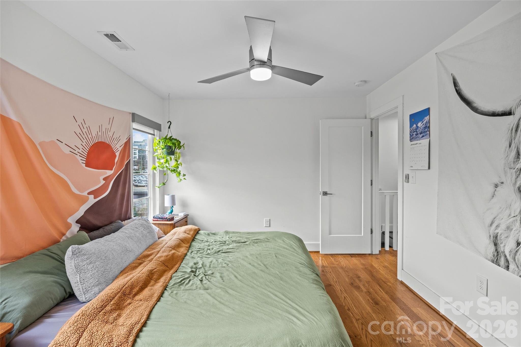 1108 North Alexander Street Charlotte, NC 28206 - Photo 23 of 37 a bedroom with a bed dresser and a window