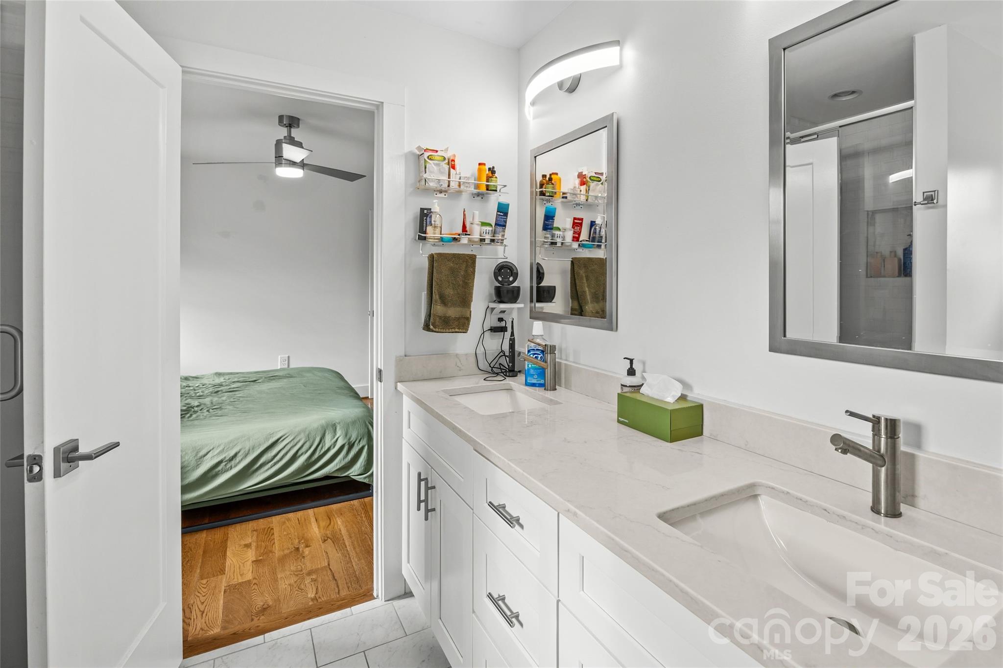 1108 North Alexander Street Charlotte, NC 28206 - Photo 24 of 37 a bathroom with double vanity sink and a mirror