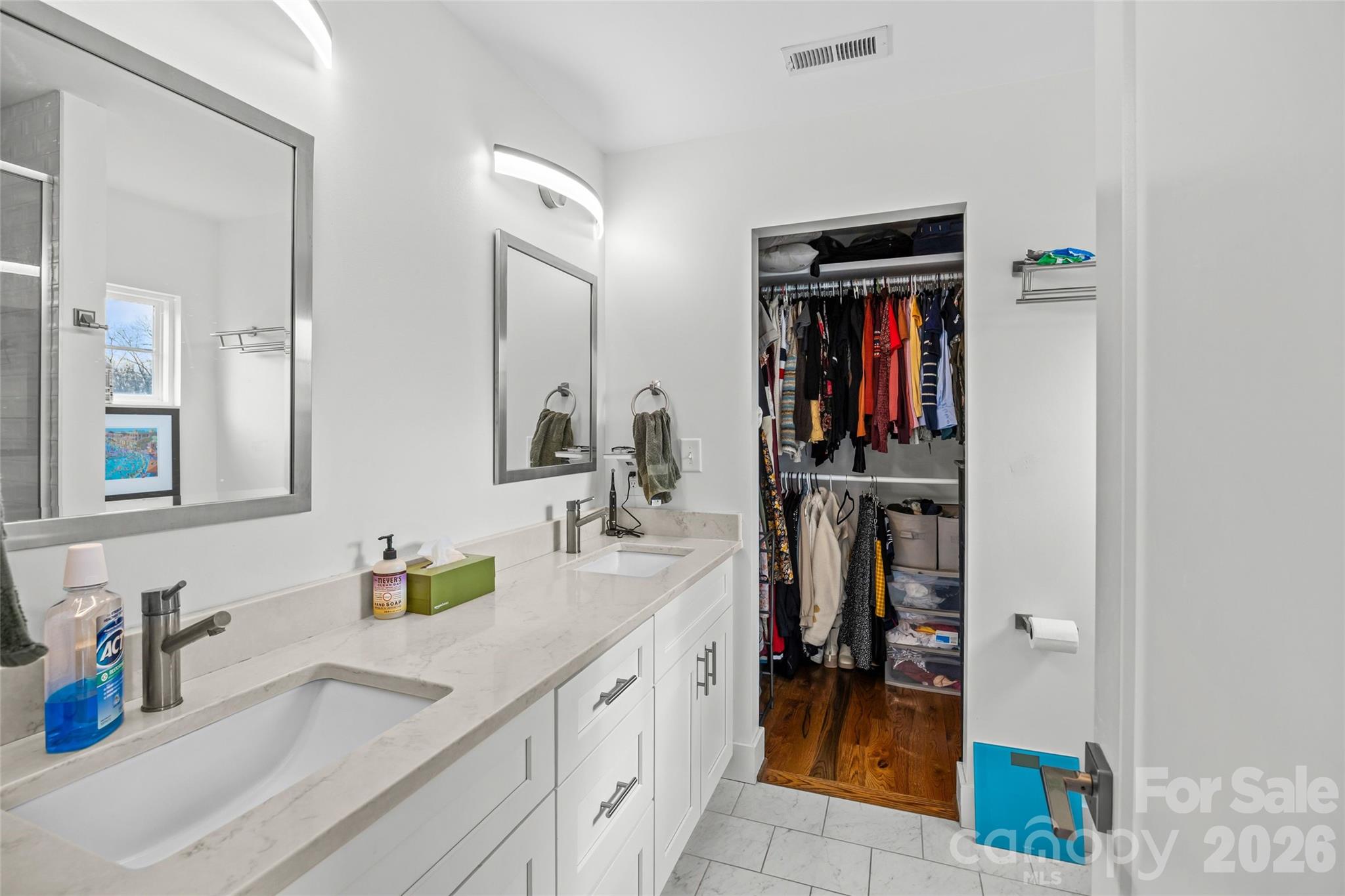 1108 North Alexander Street Charlotte, NC 28206 - Photo 26 of 37 a en suite bathroom with a double vanity sink and a mirror