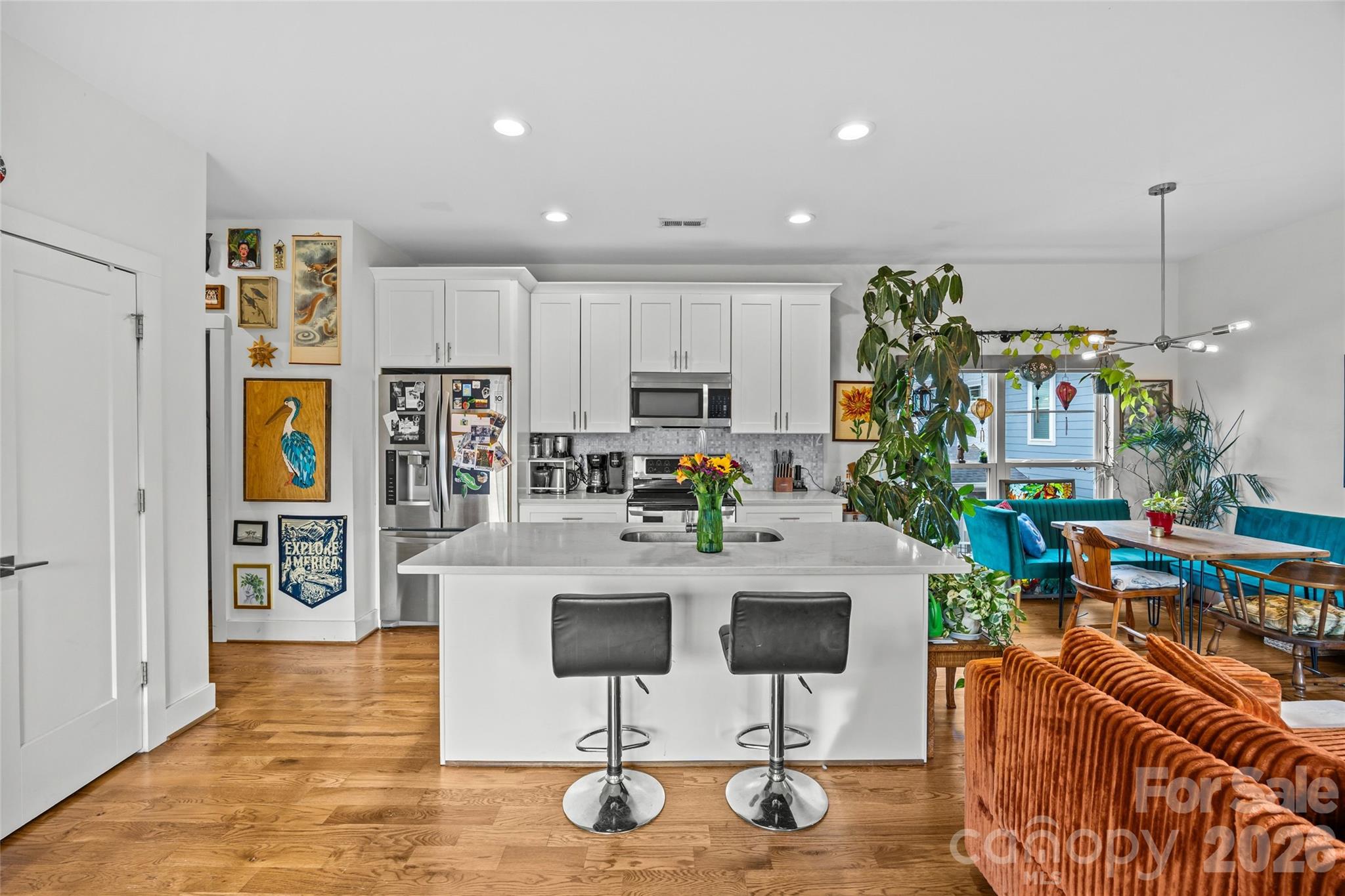 1108 North Alexander Street Charlotte, NC 28206 - Photo 9 of 37 a kitchen with stainless steel appliances granite countertop a refrigerator and a stove top oven
