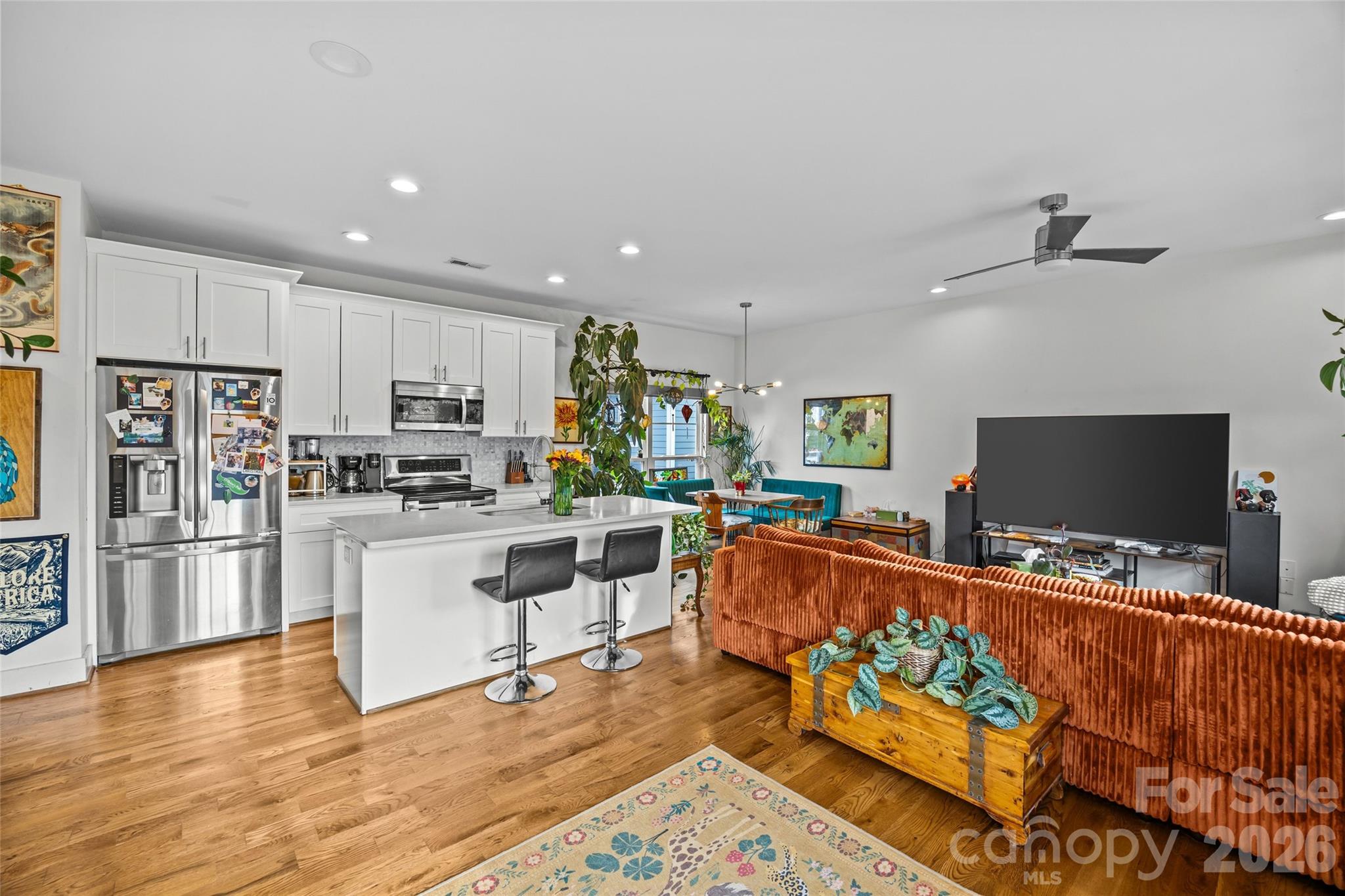 1108 North Alexander Street Charlotte, NC 28206 - Photo 10 of 37 a living room with stainless steel appliances furniture and a flat screen tv