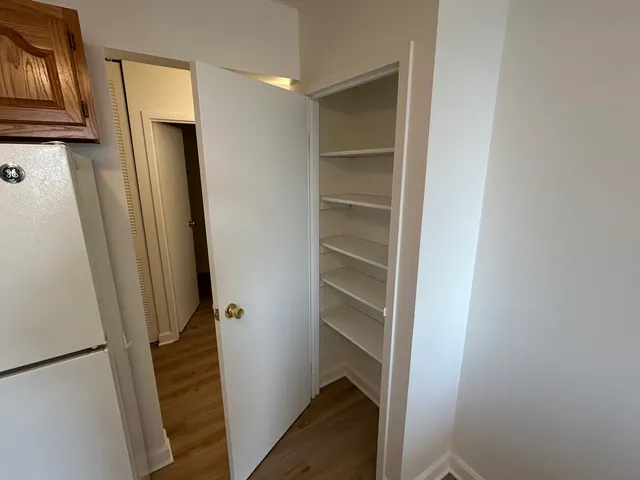 a kitchen with a refrigerator a stove top oven a sink and dishwasher