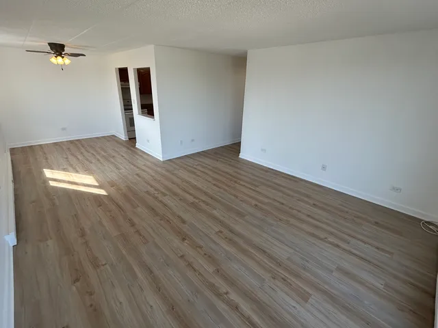 a view of balcony with wooden floor