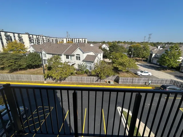 a view of a balcony with an outdoor seating