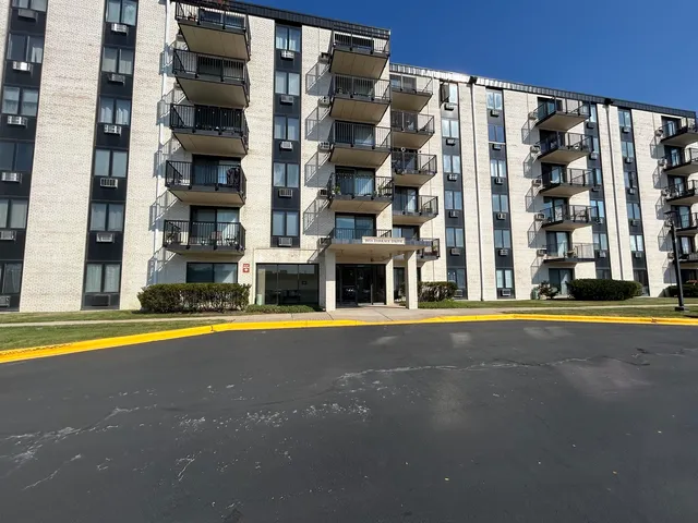 a view of building with swimming pool and windows