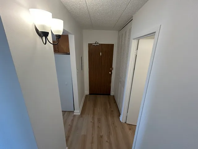 a bathroom with a sink and mirror with toilet