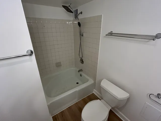 a bathroom with a bathtub and a shower