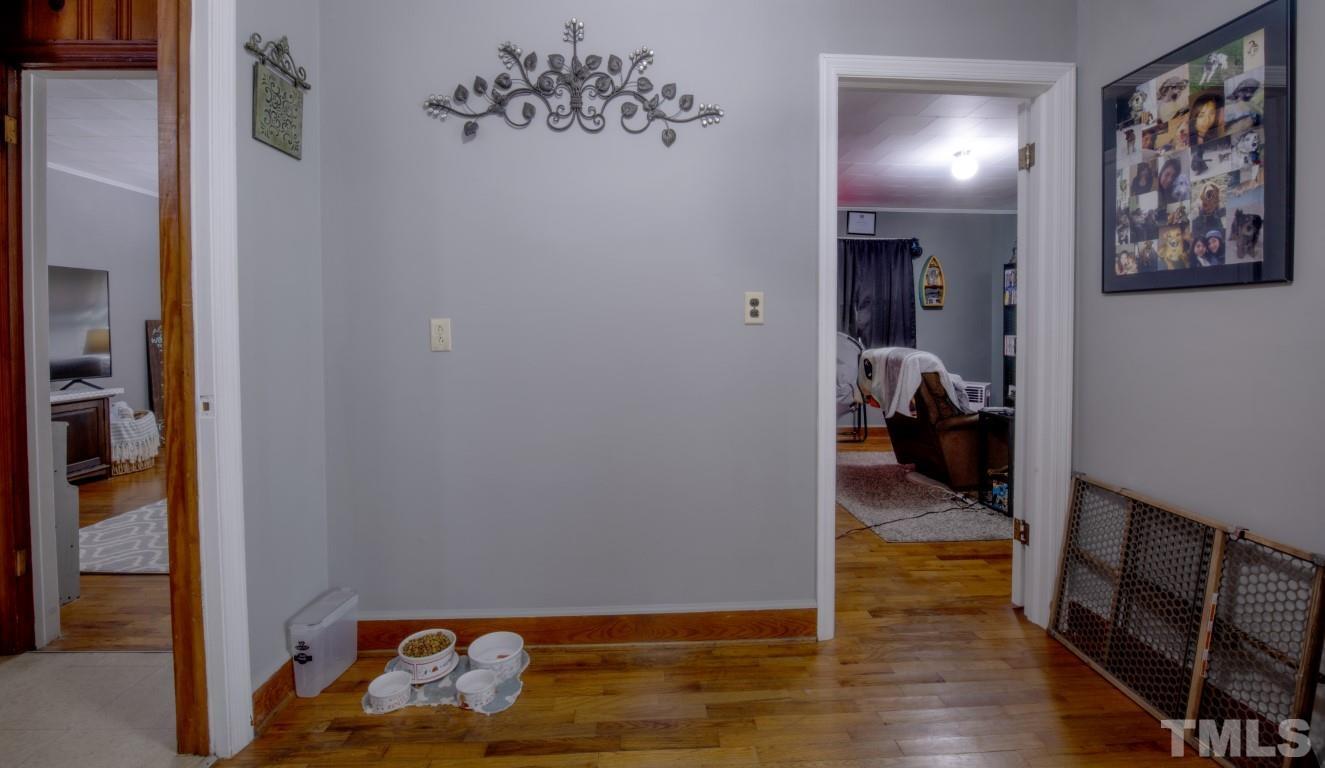 3795 Seven Paths Road Louisburg, NC 27549 - Photo 19 of 21 a bed room with a bed and a view of bathroom