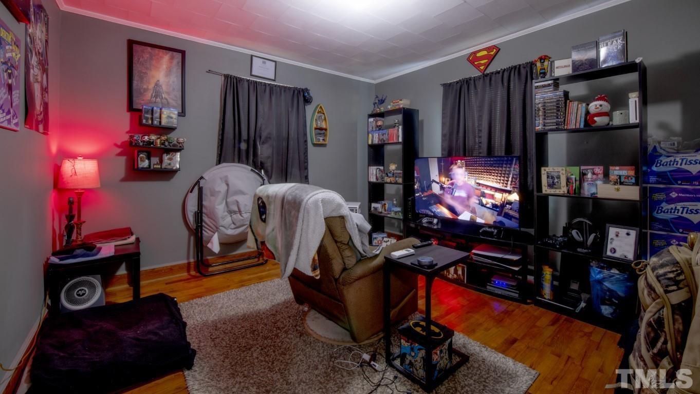 3795 Seven Paths Road Louisburg, NC 27549 - Photo 20 of 21 a room with gym equipment and a flat screen tv