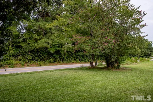 a view of outdoor space with deck and yard