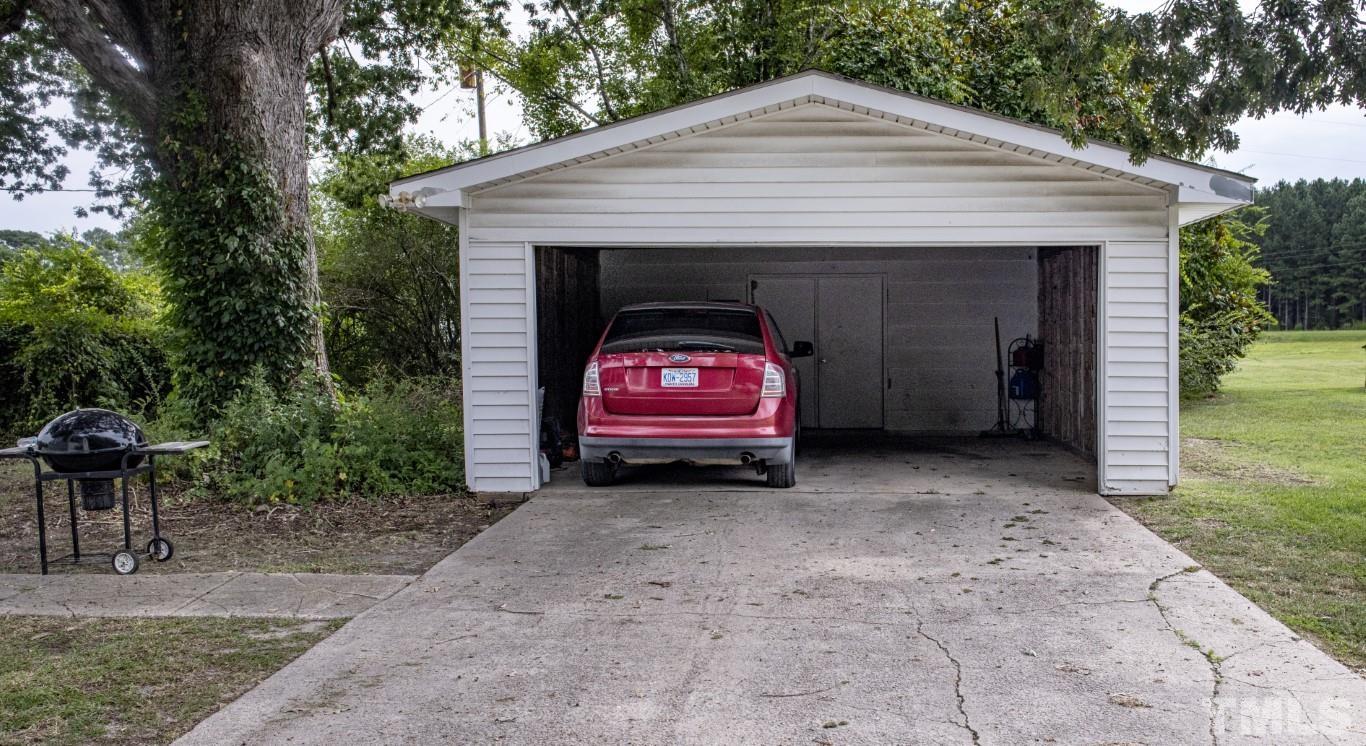 3795 Seven Paths Road Louisburg, NC 27549 - Photo 4 of 21 a view of a house with a yard and a large tree