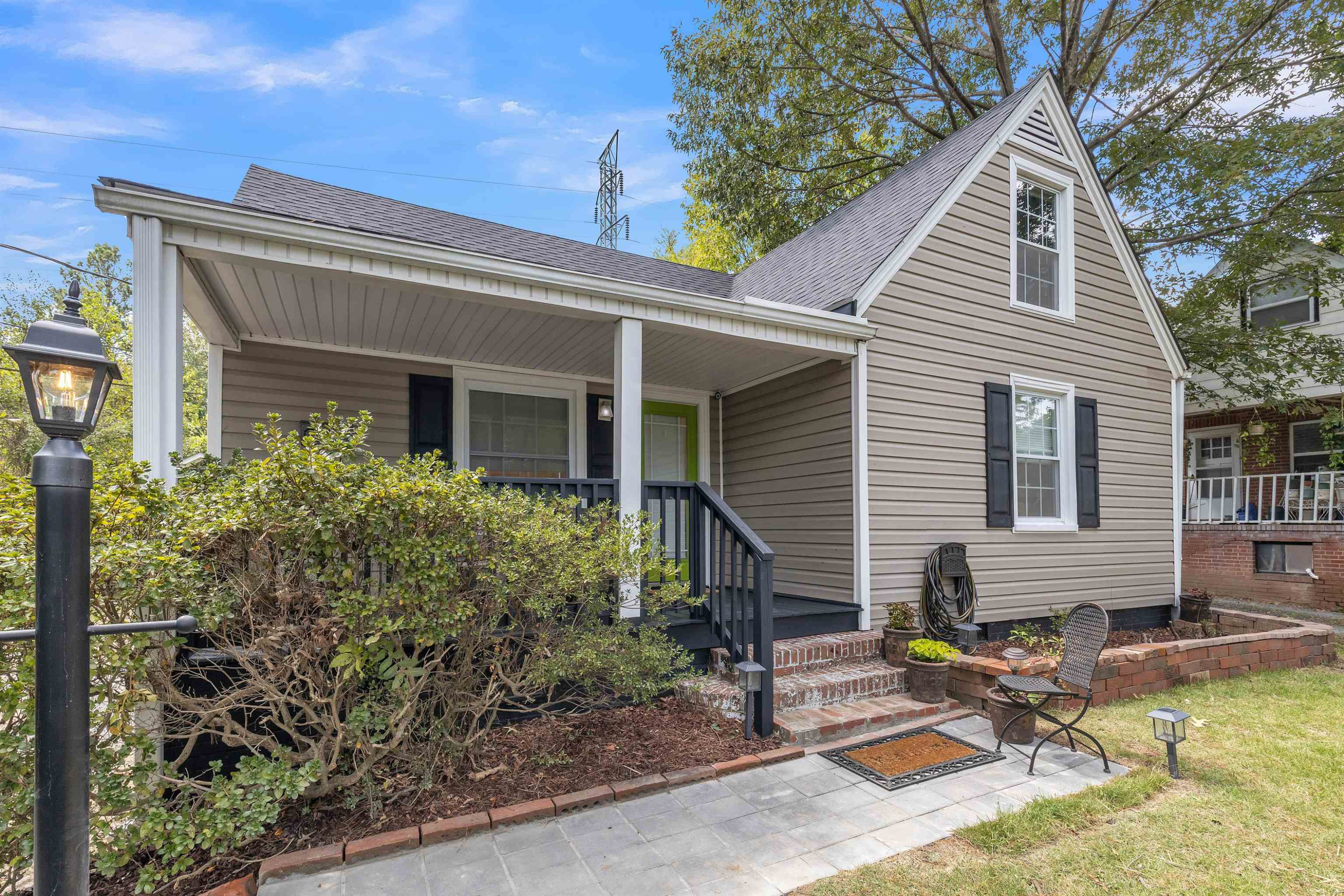 1203 North Miami Boulevard Durham, NC 27703 - Photo 1 of 22 front view of house with a yard and potted plants