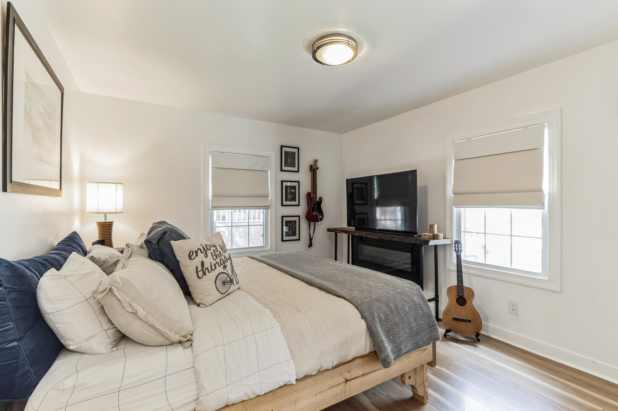 1203 North Miami Boulevard Durham, NC 27703 - Photo 12 of 22 a bedroom with a bed and a flat screen tv