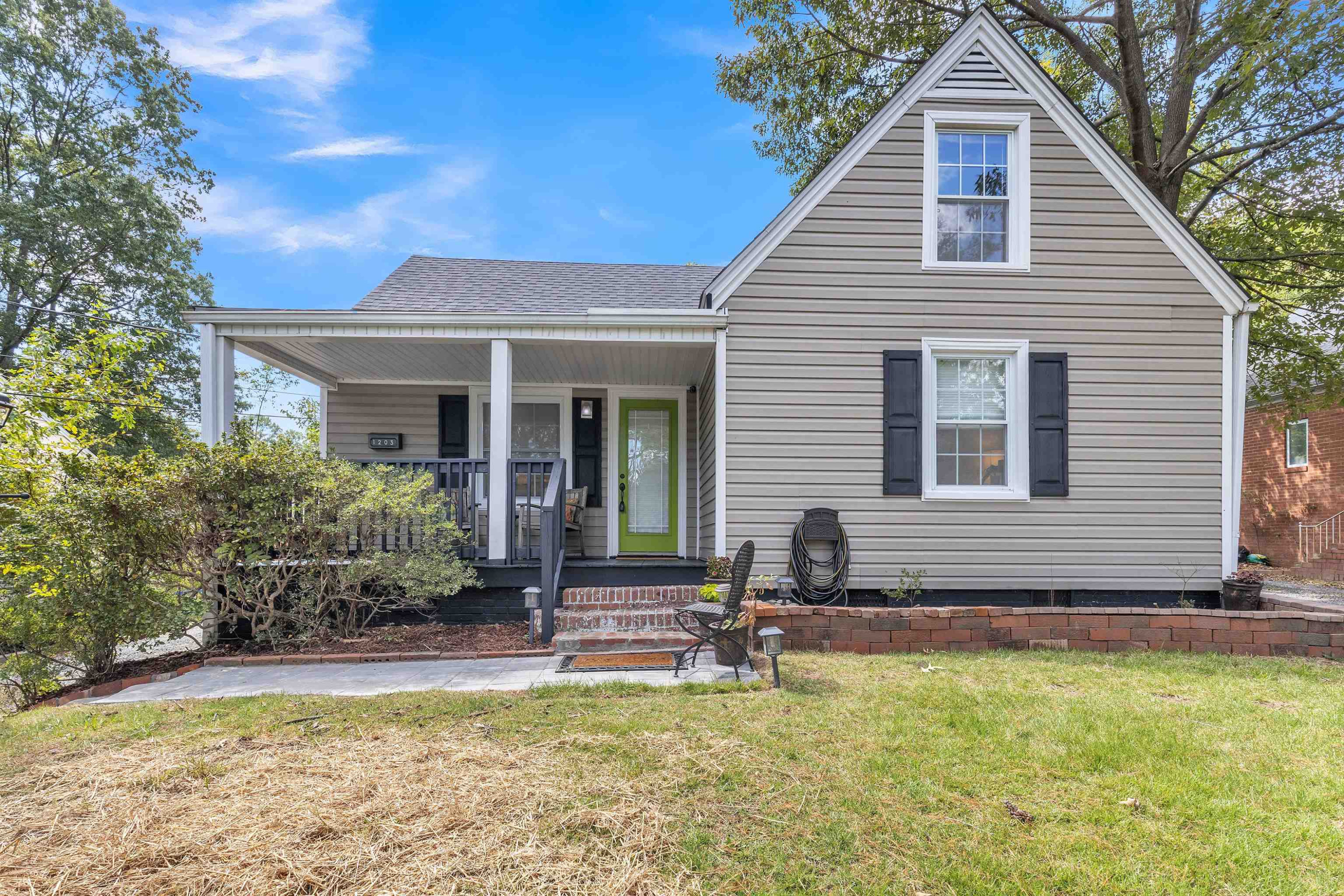 1203 North Miami Boulevard Durham, NC 27703 - Photo 2 of 22 a front view of a house with garden