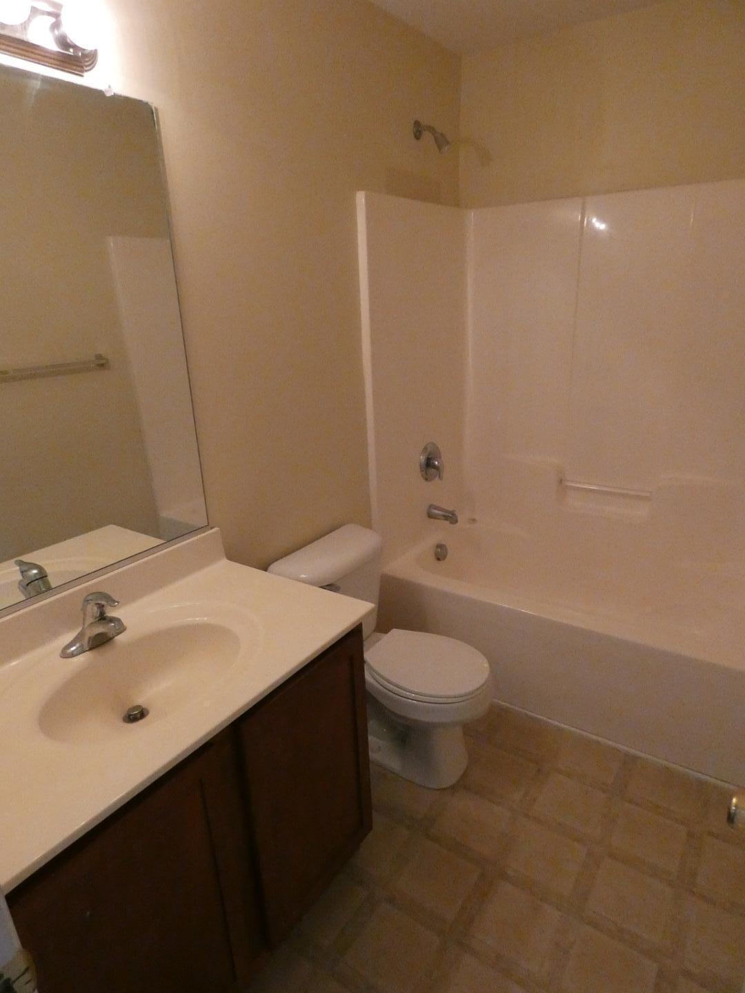 1624 Brown Owl Drive Raleigh, NC 27610 - Photo 20 of 22 a bathroom with a sink a toilet and shower