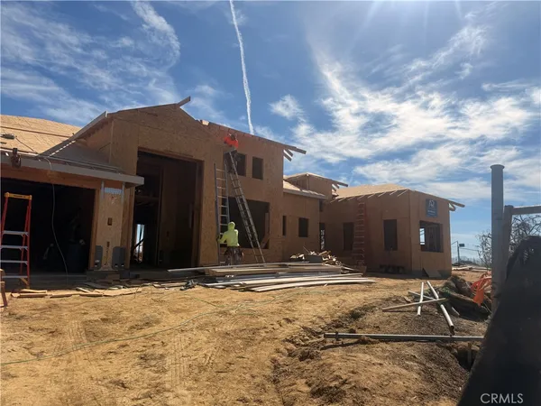 a view of a house with snow on the wall