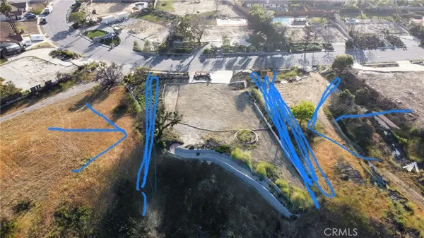 an aerial view of residential house and green space