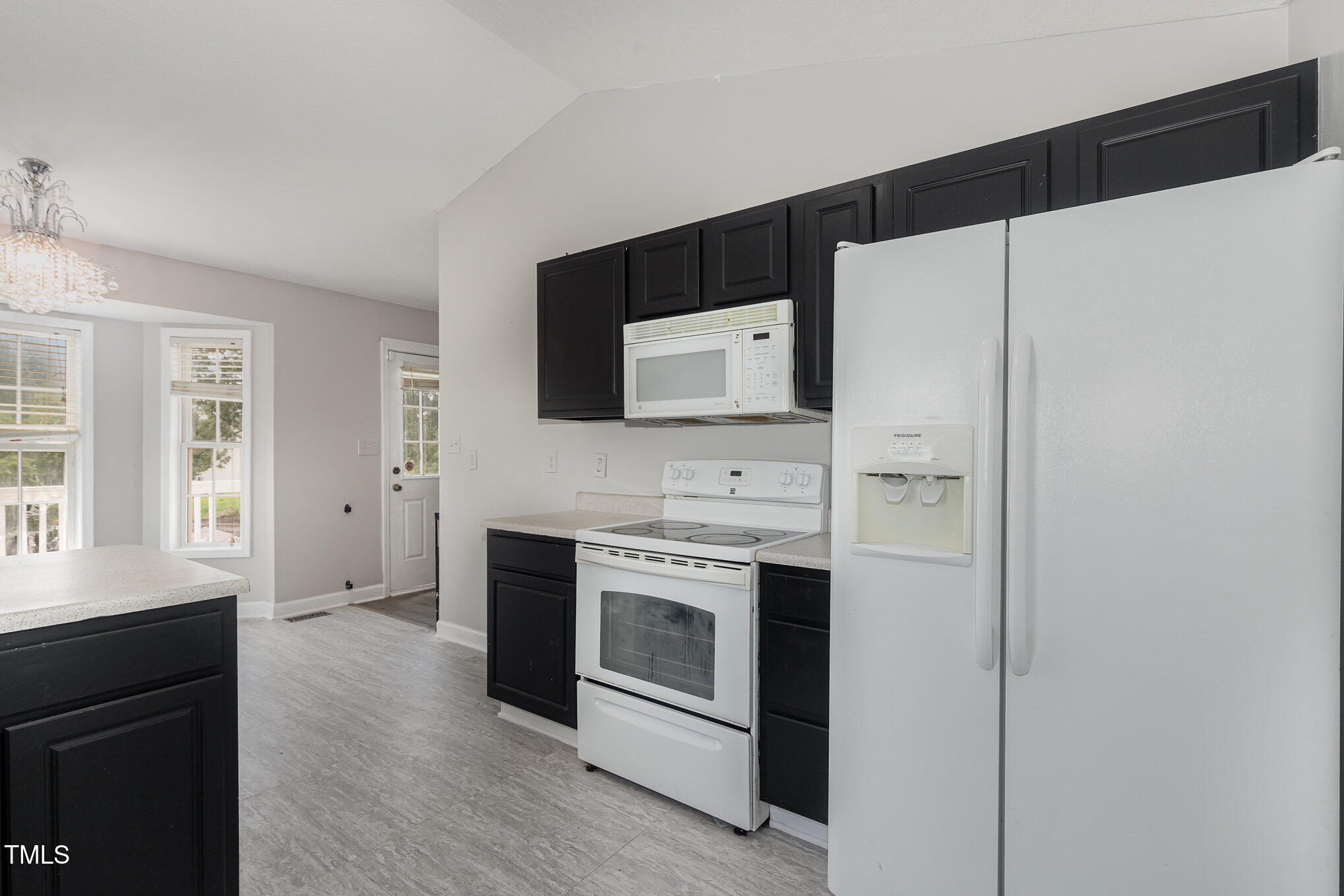 3485 Green Valley Road Fayetteville, NC 28311 - Photo 11 of 28 a kitchen with stainless steel appliances a stove a microwave and a refrigerator
