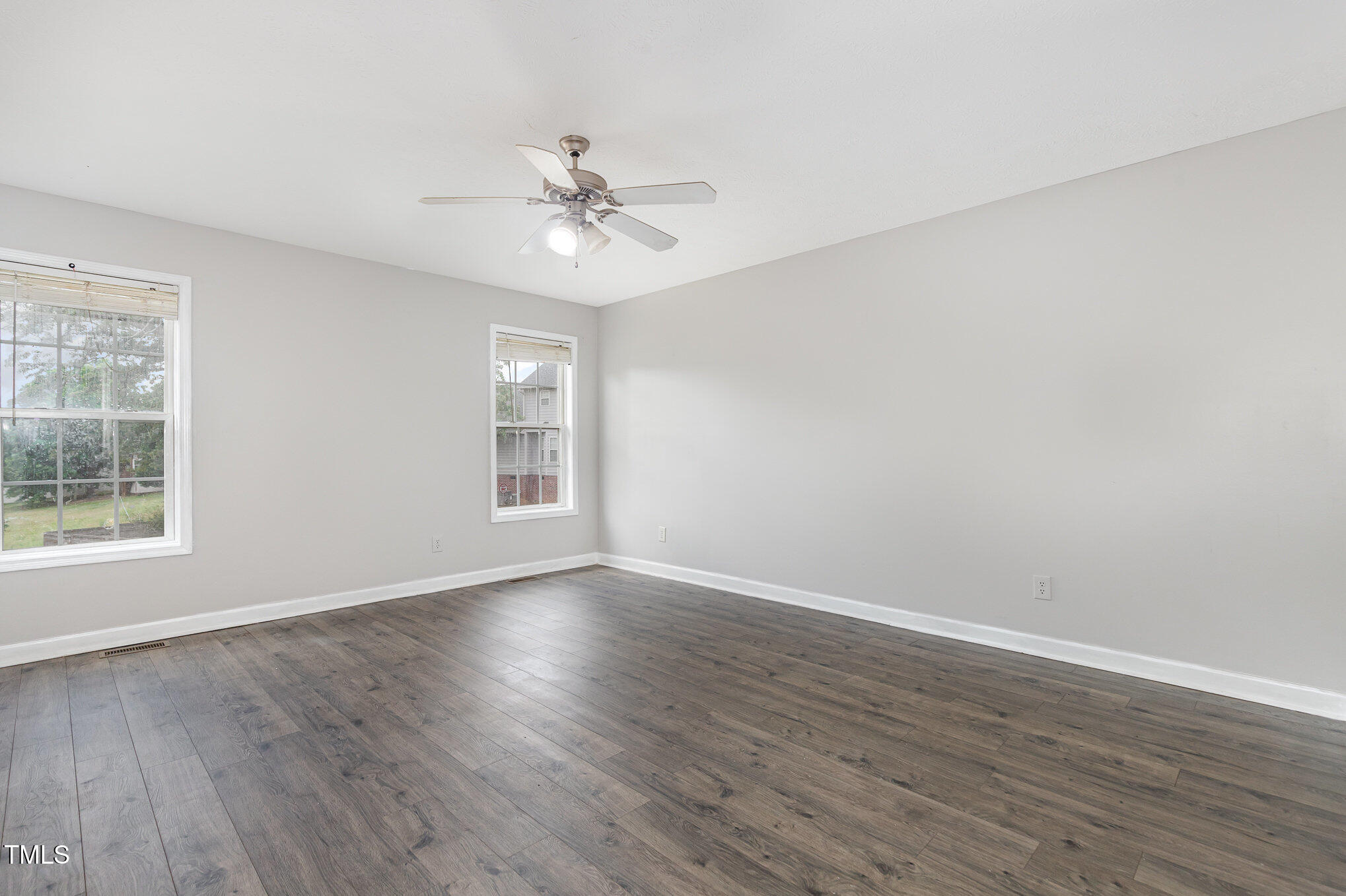 3485 Green Valley Road Fayetteville, NC 28311 - Photo 14 of 28 a view of an empty room with wooden floor and a window