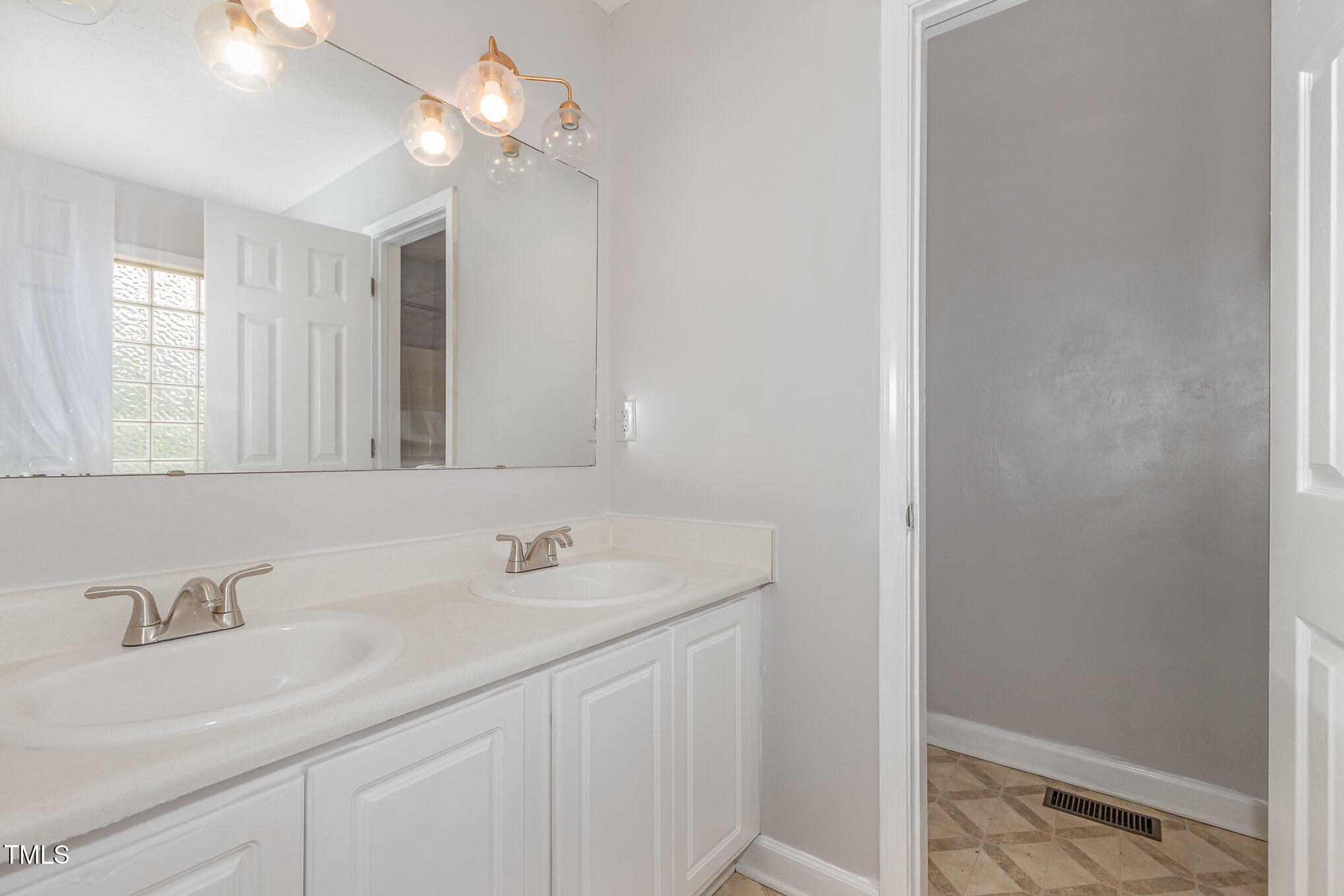 3485 Green Valley Road Fayetteville, NC 28311 - Photo 17 of 28 a bathroom with a sink and a mirror