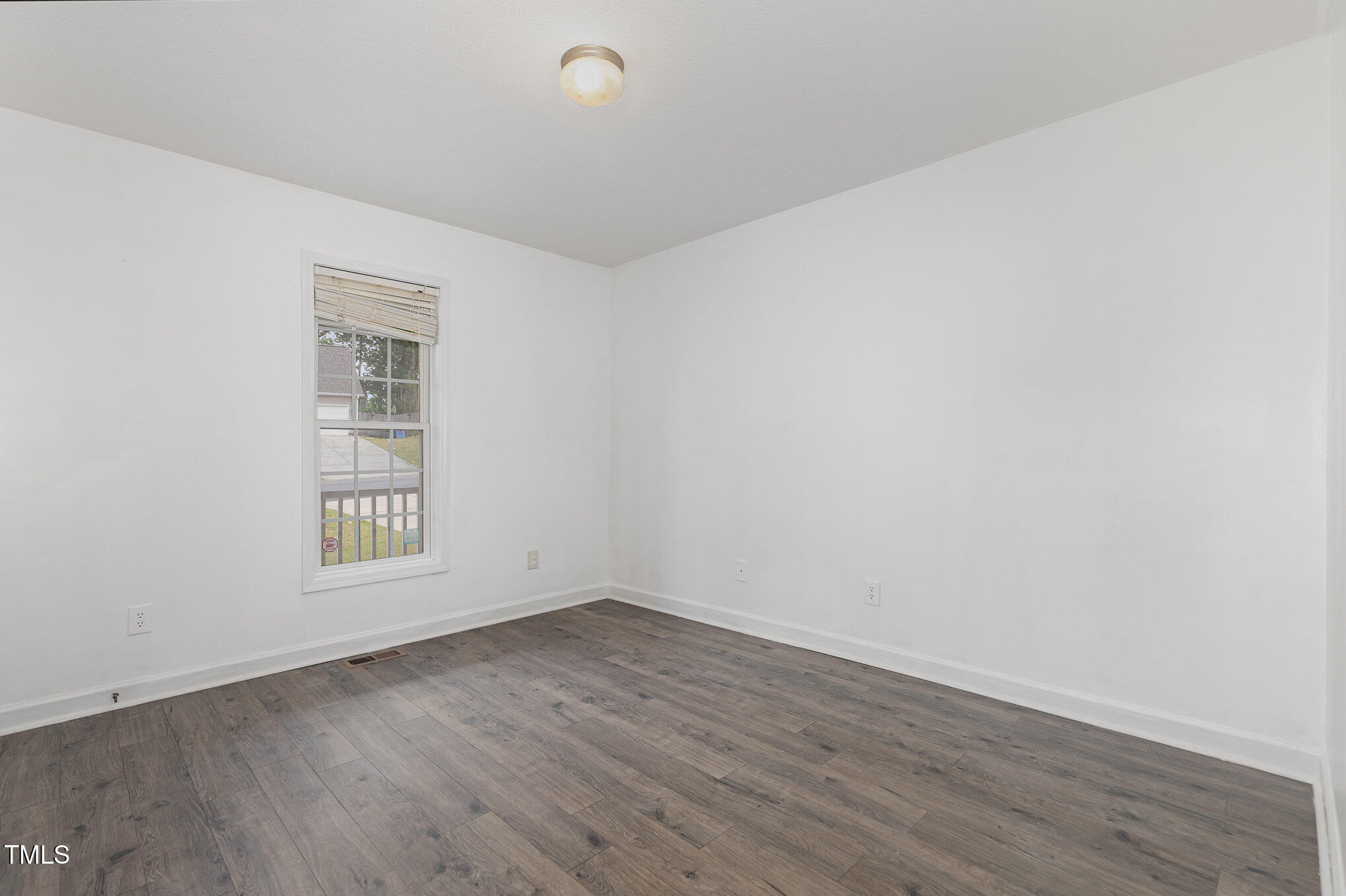 3485 Green Valley Road Fayetteville, NC 28311 - Photo 20 of 28 an empty room with wooden floor and windows