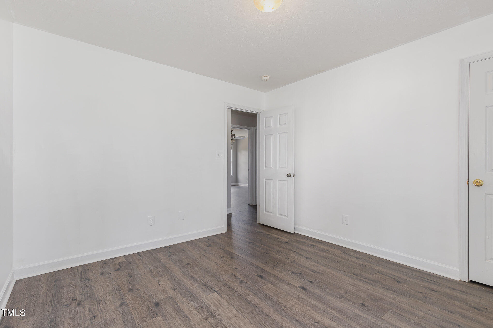 3485 Green Valley Road Fayetteville, NC 28311 - Photo 22 of 28 a view of an empty room with wooden floor