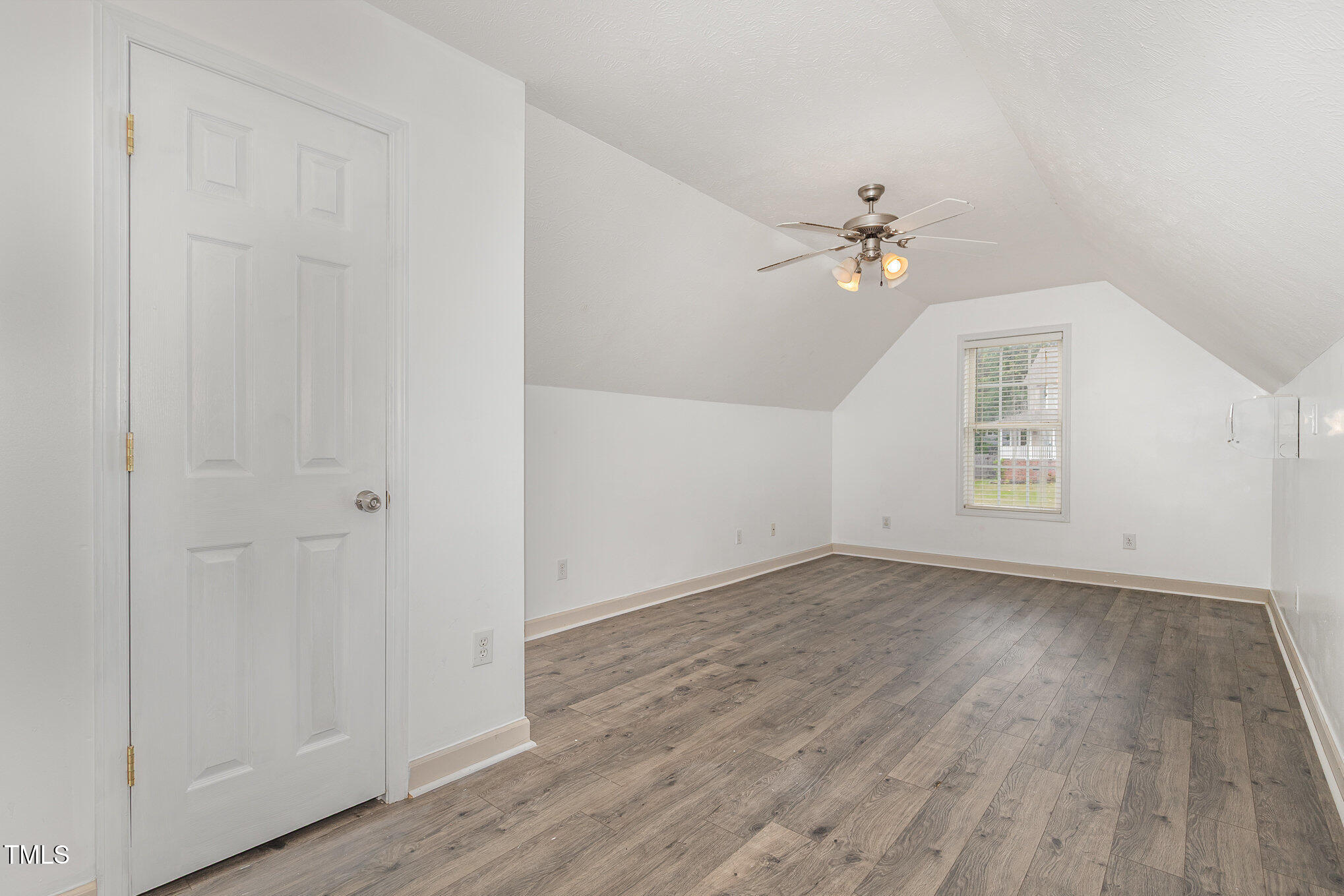 3485 Green Valley Road Fayetteville, NC 28311 - Photo 24 of 28 wooden floor in an empty room with a window