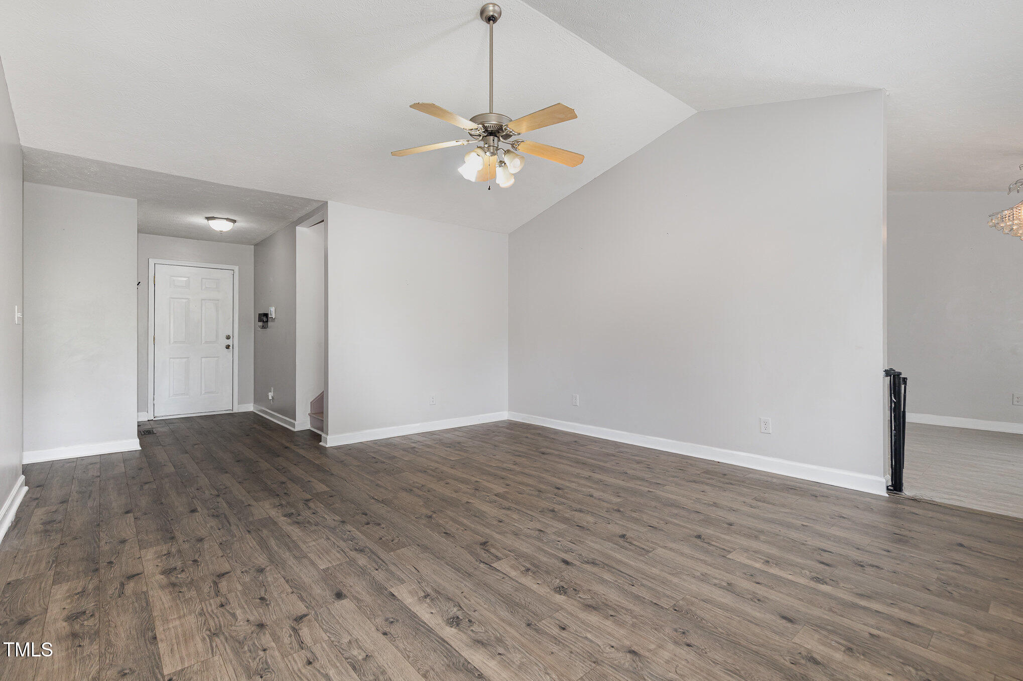 3485 Green Valley Road Fayetteville, NC 28311 - Photo 7 of 28 a view of a livingroom with a ceiling fan and wooden floor