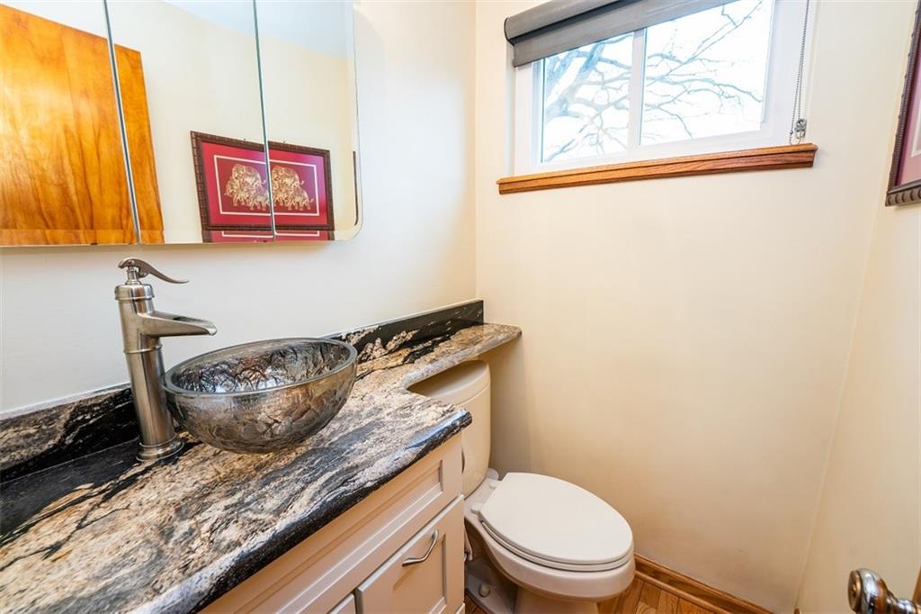 721 Rustic Lodge Road Indiana, PA 15701 - Photo 13 of 25 a bathroom with a granite countertop toilet and a sink