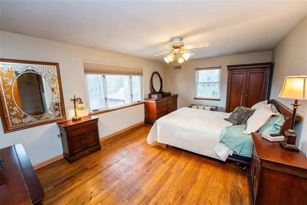 721 Rustic Lodge Road Indiana, PA 15701 - Photo 18 of 25 a bed room with furniture and a chandelier