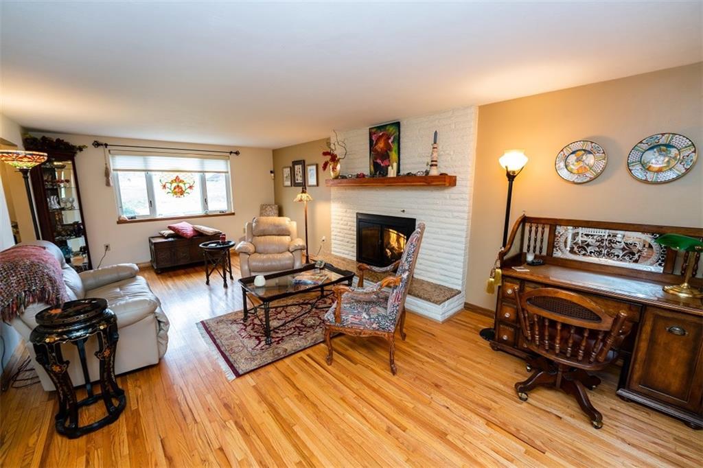 721 Rustic Lodge Road Indiana, PA 15701 - Photo 6 of 25 a living room with furniture and a fireplace