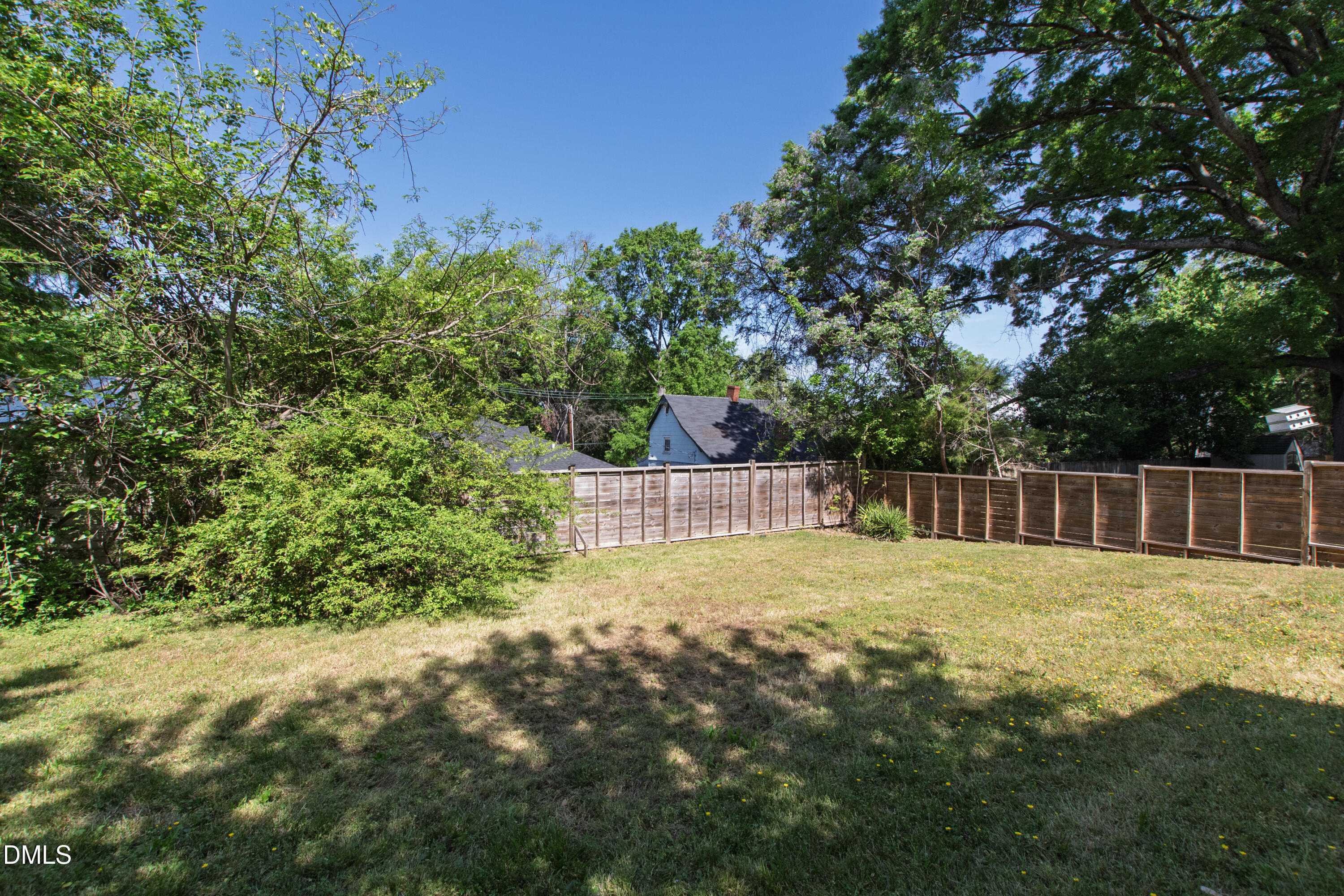 913 Washington Street Durham, NC 27701 - Photo 31 of 37 a view of a backyard with plants and large trees