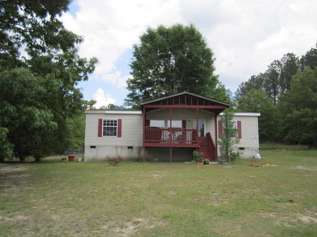 148 5th Road, Unit 20 Haddock, GA 31033 - Photo 1 of 12 a front view of a house with garden