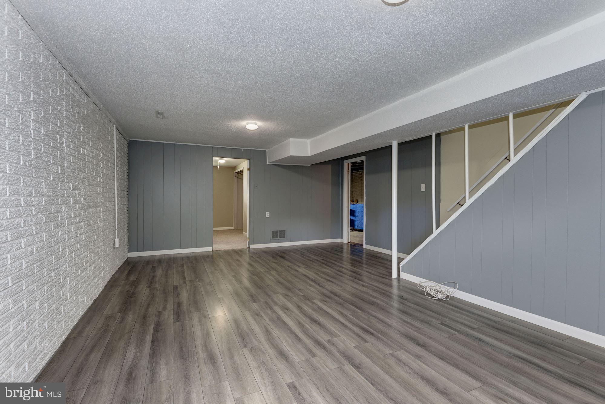 505 Old Mill Road Millersville, MD 21108 - Photo 21 of 28 Recreation Room with new laminate flooring