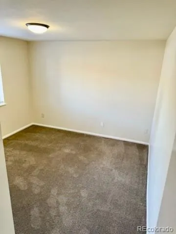 an empty room with a bench